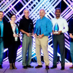 Community Award winners pose with their awards on stage